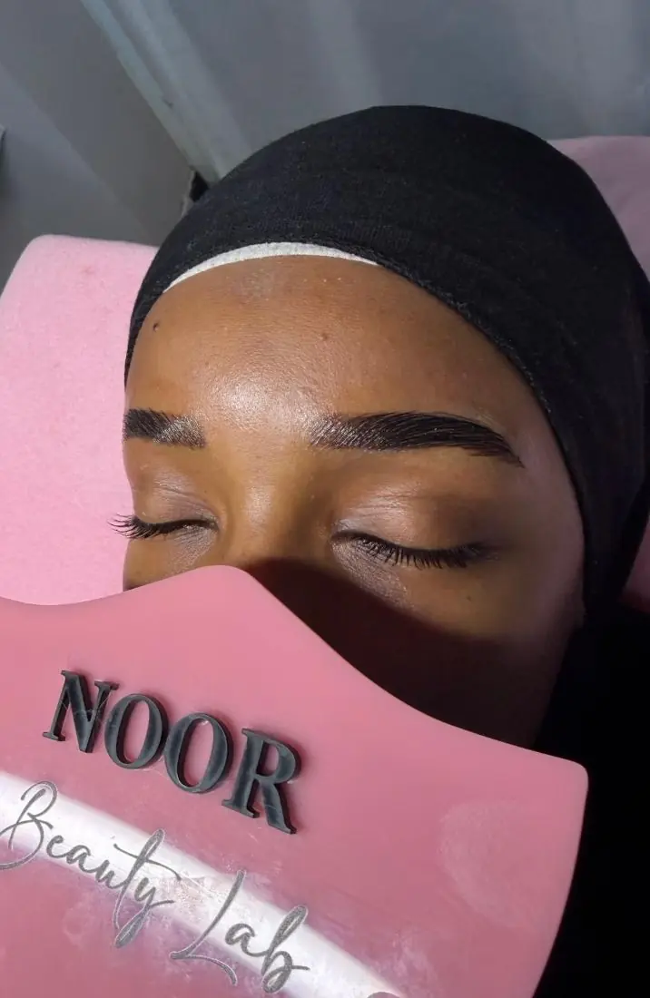 A client relaxing during brow lamination