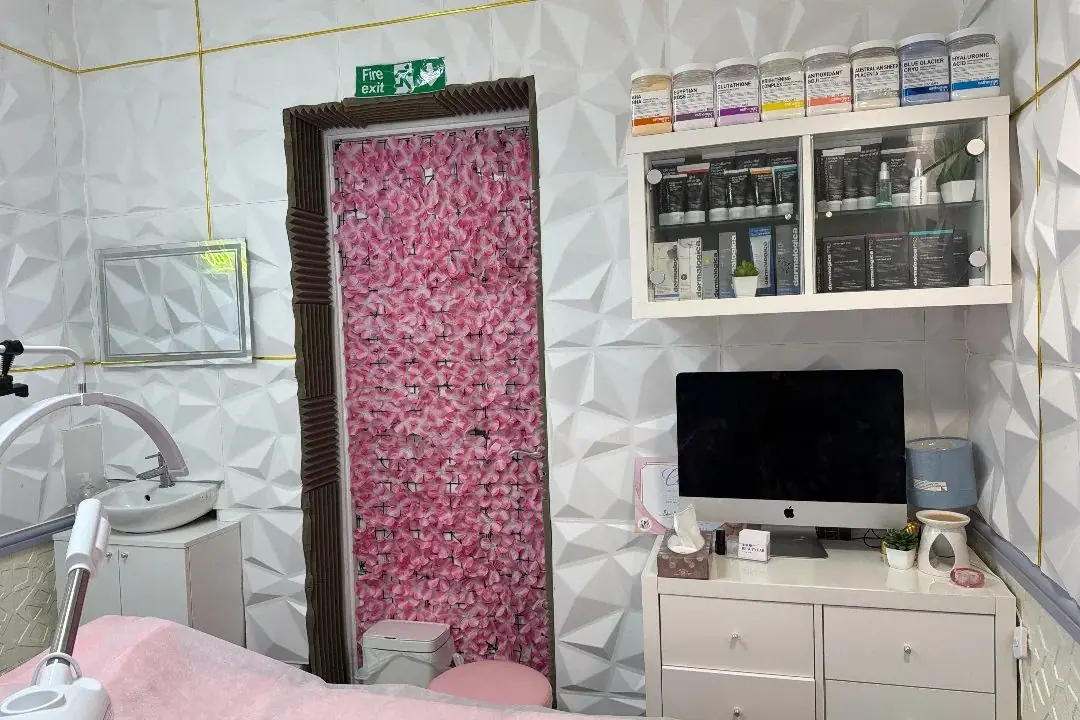 The treatment room with a pink flower wall
